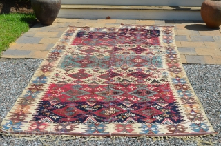 Anatolia or Northern Persia Kilim (?), beautiful colors, in nice condition, though the two panels don't match up very well.  Measures 11' 6" at its longest x 5' wide.  Nice  ...