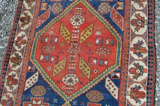 A very nice Northwest Persian runner, late 19th century.  Nice bold colors, age-appropriate wear, low areas.  Note loss to end.  Measures 11'4" x 3'2"      