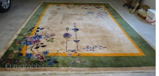 A very nice Nichols Art Deco Chinese rug circa 1920/1930.  Very pleasant neutral beige field.  Some corner damage, please see photos.  9'x12' Needs cleaning      