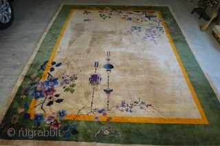 A very nice Nichols Art Deco Chinese rug circa 1920/1930.  Very pleasant neutral beige field.  Some corner damage, please see photos.  9'x12' Needs cleaning      