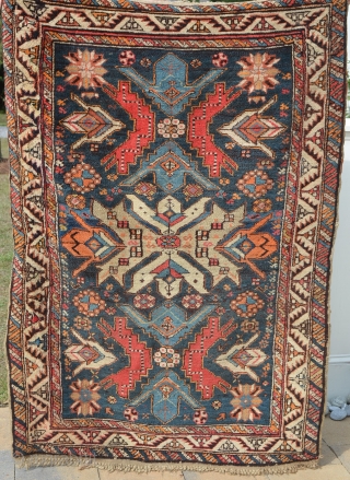 A very vibrant little Shirvan, early 20th century.  Wonderful colors, some minor restoration.  Metal hangers attached (sewn on) on the side, hangers also on one end.  Needs a cleaning.  ...