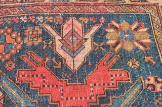 A very vibrant little Shirvan, early 20th century.  Wonderful colors, some minor restoration.  Metal hangers attached (sewn on) on the side, hangers also on one end.  Needs a cleaning.  ...