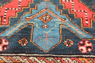 A very vibrant little Shirvan, early 20th century.  Wonderful colors, some minor restoration.  Metal hangers attached (sewn on) on the side, hangers also on one end.  Needs a cleaning.  ...