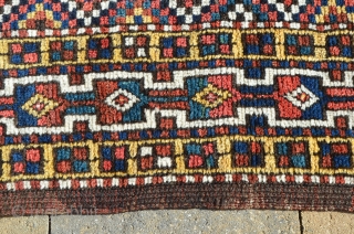 A very nice Kurdish carpet, circa 1900.  A couple of small repairs.  Great colors.  Measures 9'8" x 5'7"            