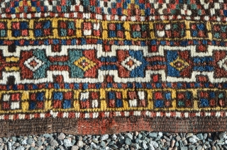 A very nice Kurdish carpet, circa 1900.  A couple of small repairs.  Great colors.  Measures 9'8" x 5'7"            