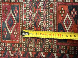 Tekke Turkmen Rug, late 20th century
Size: 320 × 201 cm (10'6" × 6'7")

A large Tekke rug with the traditional repeating gul pattern, framed by multiple geometric borders. The field is dyed in  ...