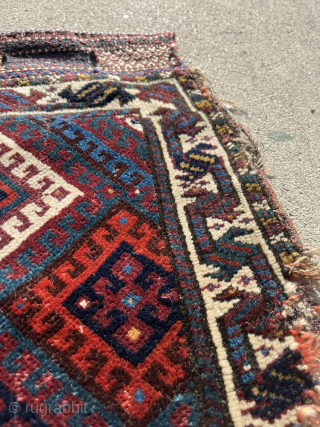 Fine Jaff bag face with an unusual color palette featuring two purples. Nice saturated dyes. Obvious condition issues but still a really great piece with a good range of colors. The wonky  ...