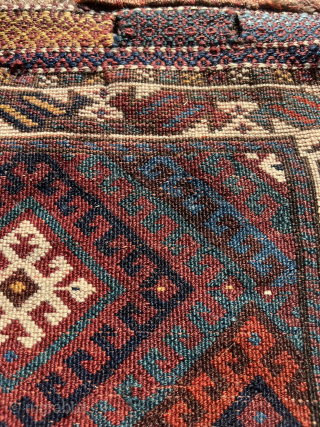 Fine Jaff bag face with an unusual color palette featuring two purples. Nice saturated dyes. Obvious condition issues but still a really great piece with a good range of colors. The wonky  ...