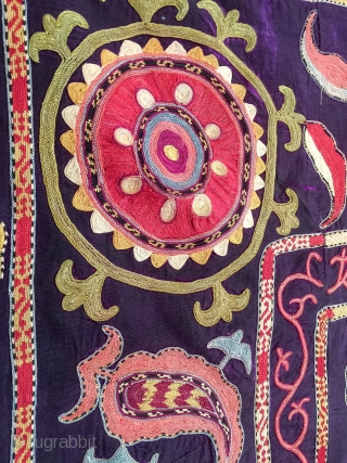A dynamic Antique Uzbek silk suzani / Susani dating to late 19th Century from rural areas of shahrisabz. It has fine chain stitched silk on a dark indigo silk woven ground. The  ...