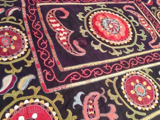 A dynamic Antique Uzbek silk suzani / Susani dating to late 19th Century from rural areas of shahrisabz. It has fine chain stitched silk on a dark indigo silk woven ground. The  ...