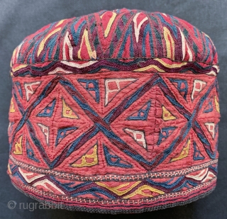 An rare antique Turkoman / Turkmen silk embroidered on silk bridal hat attributed to the Tekke / Teke tribe. Dating to the 19th century, this brilliant textile was an integral part of  ...