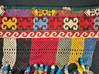 An exceptional antique Uzbek Lakai Tribe silk cross stitched embroidered 'saygosha' hanging, dating to late 19th century. These 'v' shaped hangings were dowry textiles, initially made to attach to the elegant and  ...