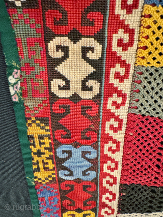 An exceptional antique Uzbek Lakai Tribe silk cross stitched embroidered 'saygosha' hanging, dating to late 19th century. These 'v' shaped hangings were dowry textiles, initially made to attach to the elegant and  ...