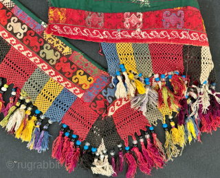 An exceptional antique Uzbek Lakai Tribe silk cross stitched embroidered 'saygosha' hanging, dating to late 19th century. These 'v' shaped hangings were dowry textiles, initially made to attach to the elegant and  ...