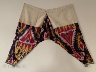 a very rare complete antique Uzbek silk atlas satin weave Ikat trousers dating to the 19th Century. This highly collectible ethnographic garment is attributed to the city of Bukhara. Such silk embroidered  ...