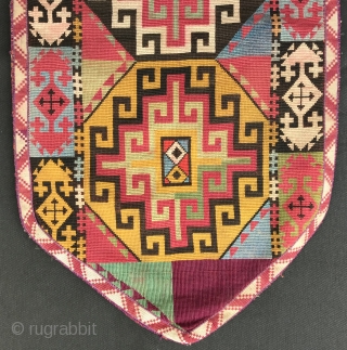 An outstanding example of Antique Uzbek Lakai tribe silk cross stitched shield shaped talismanic hanging known as Uut Kap Ilgich, dating to the 19th century. This is one of the best examples  ...