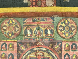 A beautiful antique Tibetan silk painted Buddhist Thangka from 19th century Tibet. At the centre of the colourful design is an elaborate Mandala with Buddha / Lama figures on each corner. The  ...