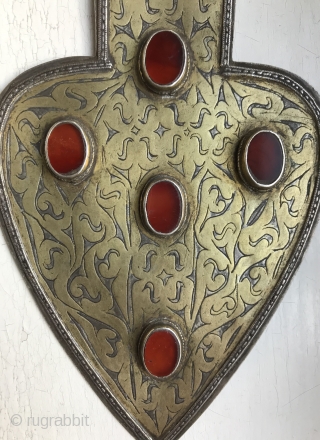 An Excellent  Antique Turkoman / Turkmen silver pendant with gold painted and fired and carnelian inset. These heart shaped pendants (worn in a necklace ) are known as 'Asyk' and this  ...