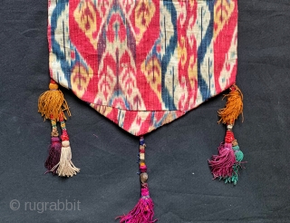 An outstanding Antique mid 19th century Uzbek Adras Ikat shield shaped hanging from Bokhara / Bukhara region. It is a haft rant / seven colour Ikat which is considered the highest form  ...