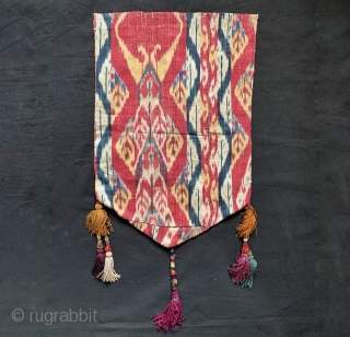 An outstanding Antique mid 19th century Uzbek Adras Ikat shield shaped hanging from Bokhara / Bukhara region. It is a haft rant / seven colour Ikat which is considered the highest form  ...