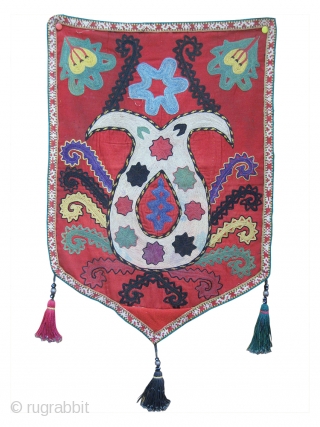 An excellent Antique Uzbek Lakai Uut kap Ilgich embroidered Suzani. This shield shaped embroidery dates to late 19th century and is executed with fine polychrome silks in a chain-stitched manner on a  ...