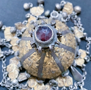 An extraordinary silver with gold appliqué with carnelian inset antique Turkoman / Turkmen Jewellery attributed to the Yomud / Yomud confederation tribes. Dating to the 19th century, this is a coveted example  ...