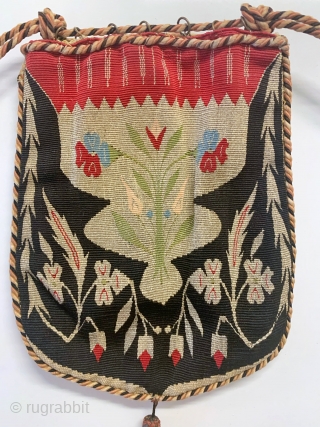 A magnificent antique Syrian Aleppo silk and gold/silver metallic tapestry weave bag from late 19th century - early 1900’s. An extremely rare and fine textile boasting an elegant floral design surrounded by  ...