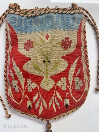 A magnificent antique Syrian Aleppo silk and gold/silver metallic tapestry weave bag from late 19th century - early 1900’s. An extremely rare and fine textile boasting an elegant floral design surrounded by  ...