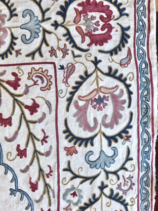 An outstanding antique Uzbek Shahrisabz silk Suzani, showcasing exceptionally fine silk chain-stitched embroidery on an unusual silk blend (?) textured and patterned white ground fabric. Dating close to mid 19th century, it  ...