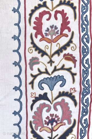 An outstanding antique Uzbek Shahrisabz silk Suzani, showcasing exceptionally fine silk chain-stitched embroidery on an unusual silk blend (?) textured and patterned white ground fabric. Dating close to mid 19th century, it  ...