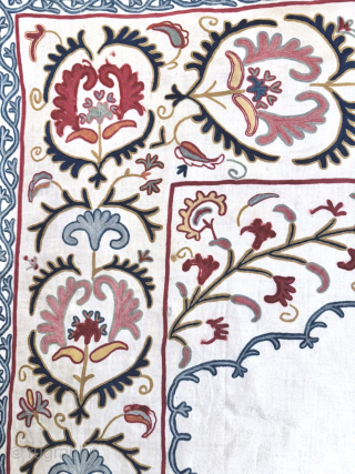 An outstanding antique Uzbek Shahrisabz silk Suzani, showcasing exceptionally fine silk chain-stitched embroidery on an unusual silk blend (?) textured and patterned white ground fabric. Dating close to mid 19th century, it  ...