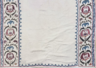 An outstanding antique Uzbek Shahrisabz silk Suzani, showcasing exceptionally fine silk chain-stitched embroidery on an unusual silk blend (?) textured and patterned white ground fabric. Dating close to mid 19th century, it  ...