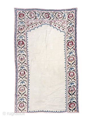 An outstanding antique Uzbek Shahrisabz silk Suzani, showcasing exceptionally fine silk chain-stitched embroidery on an unusual silk blend (?) textured and patterned white ground fabric. Dating close to mid 19th century, it  ...