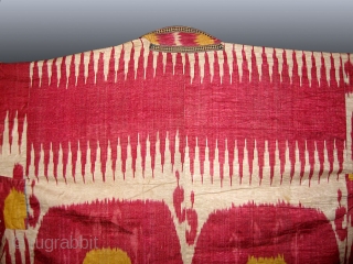 A Fabulous Antique Uzbek Ikat Robe from Bokhara / Bukhara. It is an adras Ikat (silk warp/cotton weft) from late 19th Century. The gorgeous design of two large medallion surrounded by zig  ...