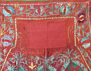 A lovely antique Uzbek Lakai silk embroidered horse blanket / saddle cover. This lovely ethnographic embroidery dates to the late 19th century and is polychrome silk chain stitched embroidery on red wool  ...