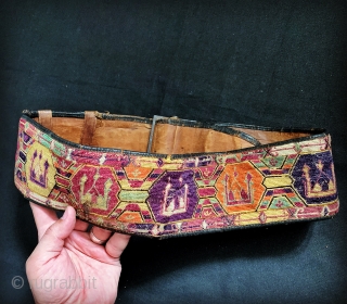 An excellent antique Central Asian silk embroidered belt with original leather backing, pocket and gilded insert buckle. It dates to late 19th century and it is an excellent example work by a  ...