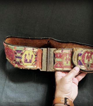 An excellent antique Central Asian silk embroidered belt with original leather backing, pocket and gilded insert buckle. It dates to late 19th century and it is an excellent example work by a  ...