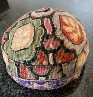 A beautiful antique Uzbek silk Iroqi stitched embroidered hat from Shahrisabz region. Dating to the late 19th century this rare hat is made of a form of cross stitched associated with the  ...