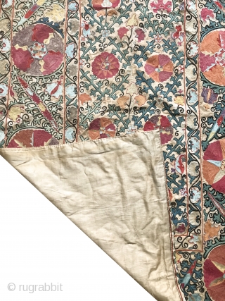 An beautiful Antique Uzbek Bokhara Suzani / Susani dating to the 19th Century. It is fine silk embroidery on Karbos (hand woven cotton) fabric using a chain stitched technique. The lattice floral  ...