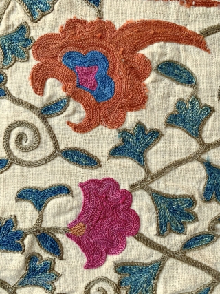 A majestic antique Uzbek silk suzani from 19th century Bukhara. This rare example boasts a magnificent and very elegant design. The lattice field contrasts beautifully with the intricately drawn free flowing floral  ...