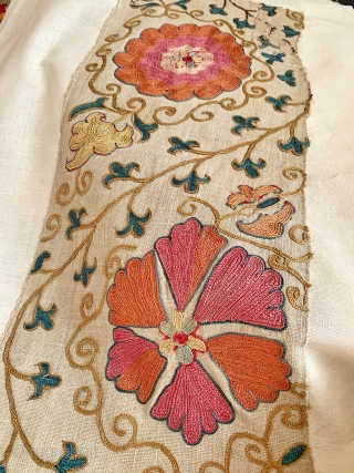 An outstanding  antique Uzbek Bukhara silk suzani fragment (stitched on a canvas ready to be mounted) dating to the mid 19th century. The embroidery is exceptional chain-stitched silk on karbos ground.  ...