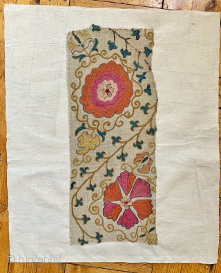 An outstanding  antique Uzbek Bukhara silk suzani fragment (stitched on a canvas ready to be mounted) dating to the mid 19th century. The embroidery is exceptional chain-stitched silk on karbos ground.  ...