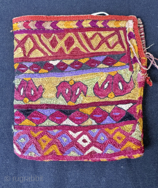 A visually dazzling Antique Turkoman / Turkmen Ersari tribe silk embroidered bag pouch dating to late 19th century - early 1900’s. It is a fully silk embroidered double-sided bag, very likely a  ...