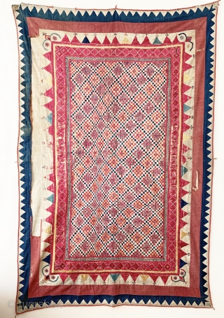 A gorgeous antique Indian silk embroidered and appliquéd wall or tent hanging from Gujarat. It dates around early 1900s and it is a visual delight. The field is made of floss silk  ...