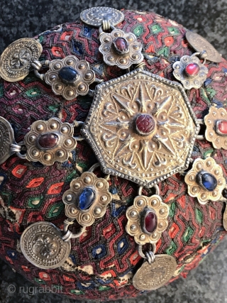 A rare complete antique silk embroidered Yomud / Yomut tribe Turkoman / Turkmen young man / boy's hat with original gold appliqué on silver  talismanic crown. There is a distinctive beauty  ...