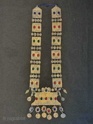 
An exceptional antique gold appliqué and silver Turkoman / Turkmen Yomut / Yomud tribe bridal necklace with the pendent in the shape of the tauk noska motif (double headed bird) . It  ...