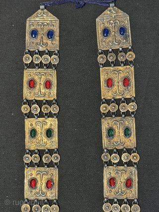 
An exceptional antique gold appliqué and silver Turkoman / Turkmen Yomut / Yomud tribe bridal necklace with the pendent in the shape of the tauk noska motif (double headed bird) . It  ...