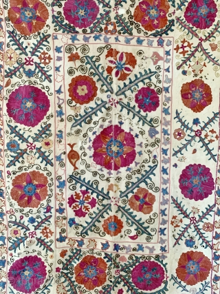 A beautiful antique Uzbek silk suzani from 3rd quarter of the 19th century rural Bukhara. It has fine polychrome silk chain-stitched embroidery on a cotton ground known as Karbos. The classic floral  ...