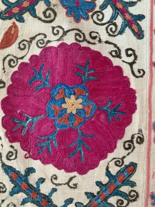 A beautiful antique Uzbek silk suzani from 3rd quarter of the 19th century rural Bukhara. It has fine polychrome silk chain-stitched embroidery on a cotton ground known as Karbos. The classic floral  ...