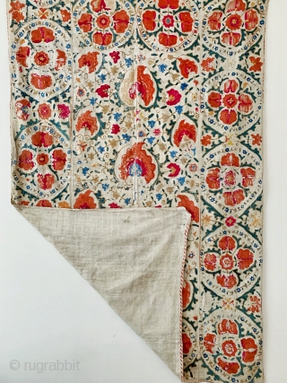 A beautiful antique Uzbek silk suzani from 19th century Bukhara. Boasting a rich floral field design with an array of palmettes, interspersed with vines and smaller floral repertoires. The borders have large  ...